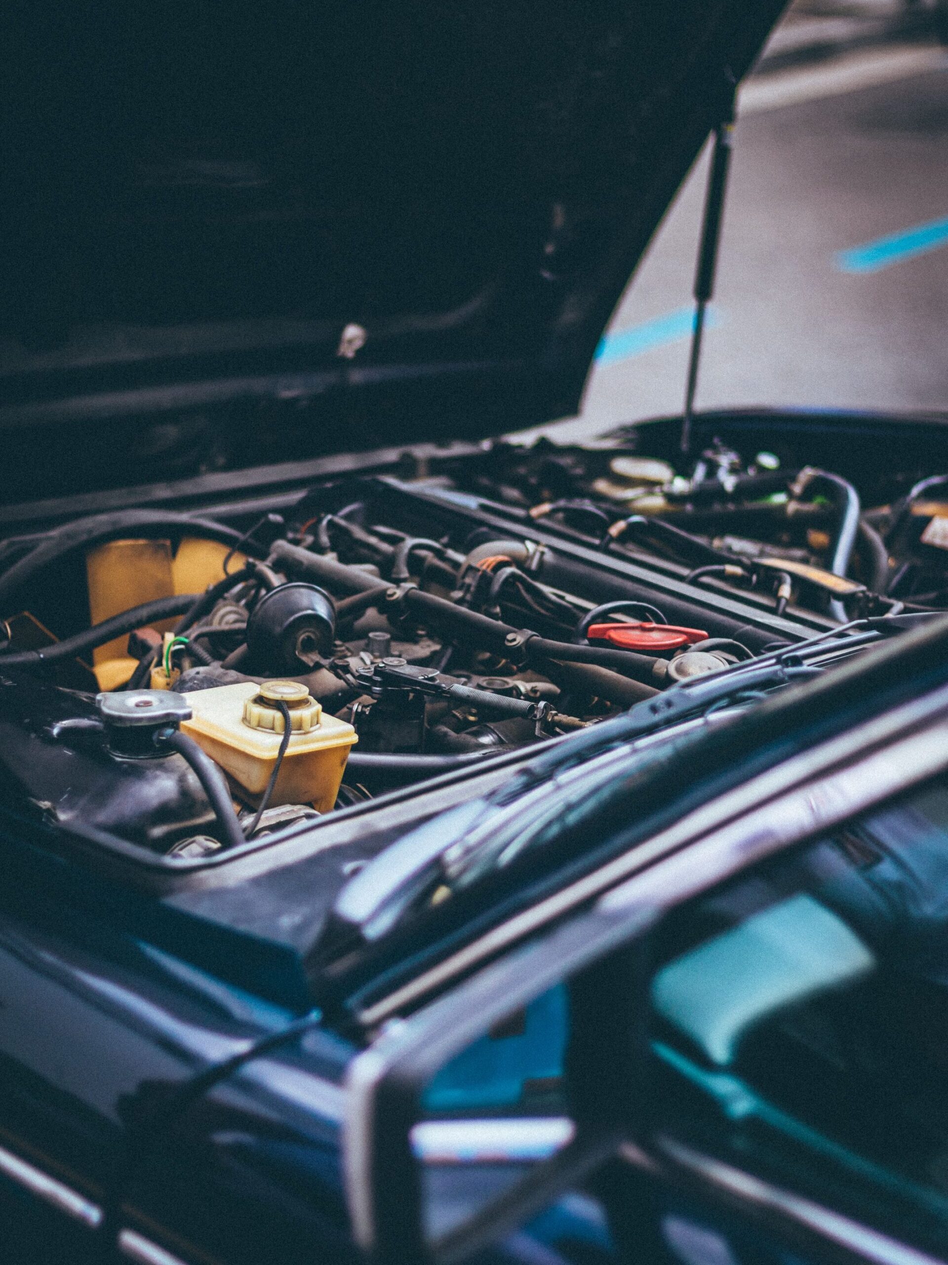 Detailed view of an exposed car engine under maintenance in Barcelona.